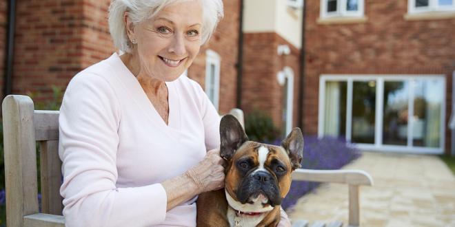 an older woman and a bulldog with sagging jowls