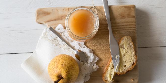 a jar of pear butter with some toast