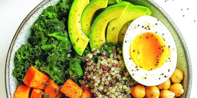 Kale, quinoa, chickpea and sweet potato salad in a bowl.