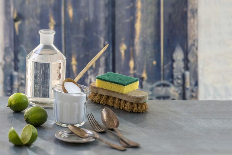 Eco friendly cleaning items with a rustic background.