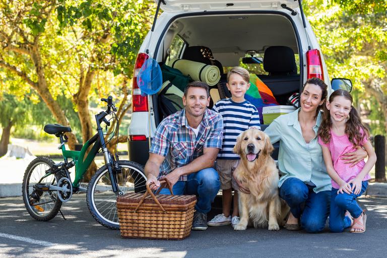 a young family packed up for a road trip