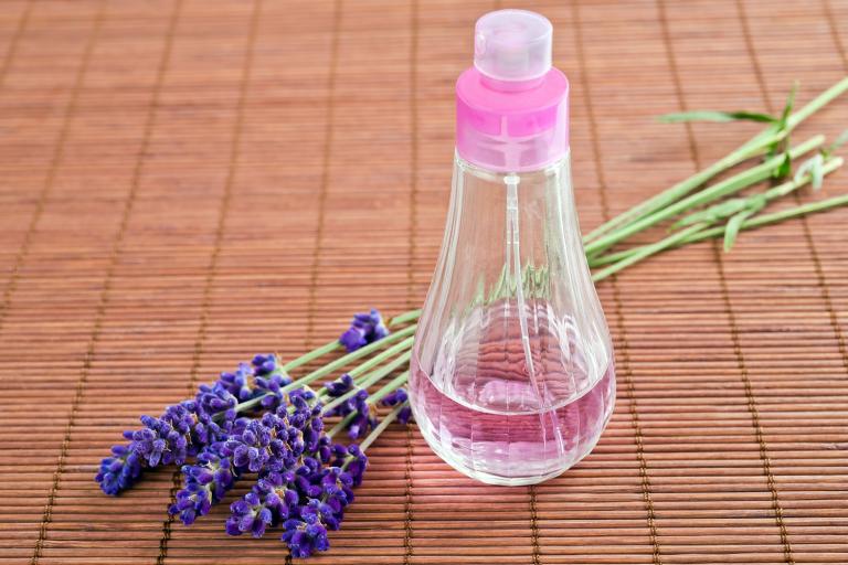  lavender flowers and a spritzer bottle of homemade hydrosol