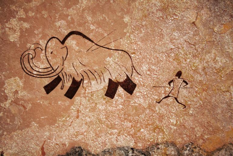 a cave drawing of hunting for food